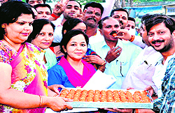 BJP workers distribute laddoos in Haridwar on Sunday to celebrate Ramesh Pokhriyal Nishanks victory in the LS polls