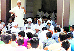 A village elder addresses the panchayat meeting in Bahbalpur village on Sunday