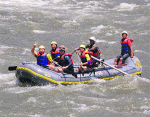 Tourists enjoy river rafting in the Beas in Mandi on Sunday.