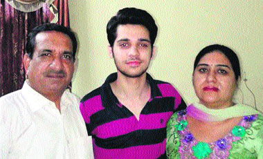 Tushar Matta, who stood second in the 12th standard exams in the medical stream with his family.