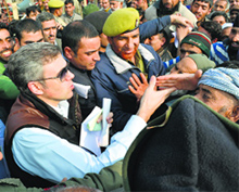 Chief Minister Omar Abdullah interacts with people during an election rally in the Valley. 