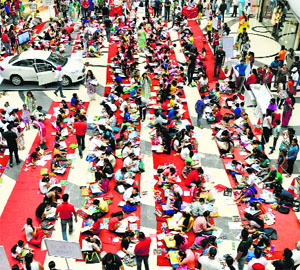 Students participate in a charity art competition organised by Round Table India in Ludhiana on Sunday.