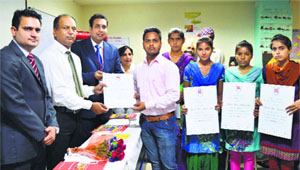 KK Singla, Chief Judicial Magistrate-cum-secretary, Punjab Legal Services Authority, Ludhiana, (second from left) presents certificates to the students of UEI Global College.