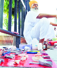A quack sells his products on the roadside in Ludhiana.