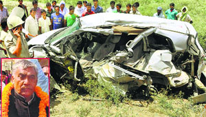 The mangled remains of the car that rammed into a train at an unmanned railway crossing in Jaunpur district, Uttar Pradesh, on Monday. State Minister Sitaram Yadav (inset), his gunman and the car driver were killed in the accident.