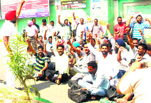 PRTC employees protest in Faridkot on Monday.