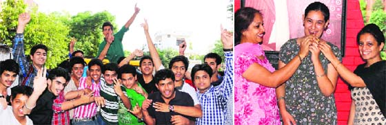 DAV students in a jubilant mood; (and right) a student of Spring Dale School being offered sweets in Amritsar on Tuesday.