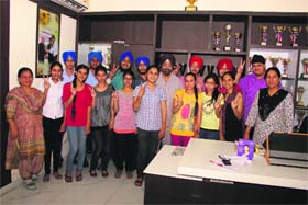 Students of Shri Guru Harkrishan Public School flash the victory sign.