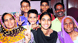 Parveen (in black dupatta) with her mother (left), grandmother (right), father (green shirt) and brothers at their residence in Bapu Dham Colony on Tuesday