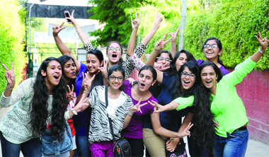 Students of Class X in a jubilant mood after knowing their results at St. Thomas School in New Delhi on Tuesday.