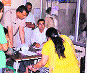 Doctors complete paper work before performing the victims medical test of at the Civil Hospital in Jhajjar.