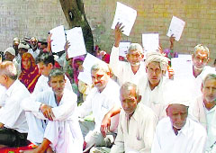 Villagers stage dharna in front of the BDPOs office in Sonepat on Tuesday. 