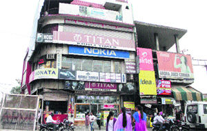 Advertisement hoardings on commercial buildings in Jalandhar.