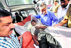 An injured being shifted to Jammu medical college on Tuesday