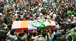 Villagers carry the coffin of Army man Mushtaq Ahmad Mir of Qazipora, who was killed in an encounter on Monday, in Budgam district on Tuesday