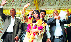 PDP president Mehbooba Mufti waves to supporters at a rally in Anantnag on Tuesday