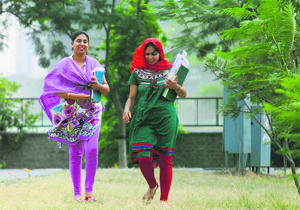 Girls caught unawares during a dust storm on the PAU campus in Ludhiana.