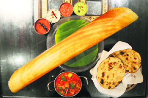 Punjabi and South Indian food being served at a restaurant in Ludhiana
