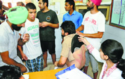 One of the victims undergoing treatment at the district hospital in Moga on Tuesday. Tribune photo