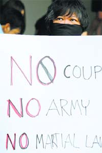 Activists protest the declaration of martial law and the Armys involvement in politics, in Bangkok on Tuesday.