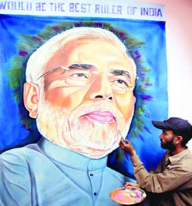 All in good spirit: Artist Jagjot Singh Rubal gives finishing touches to a painting of Bharatiya Janata Partys (BJP) prime minister-designate Narendra Modi in Amritsar