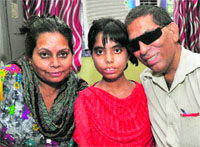 Vaishnavi with her parents at their residence in Sector 44, Chandigarh, on Wednesday. Tribune Photo