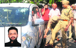 The police inspect the spot where the victims Rajwant Singh Shergill, (inset) decomposed body was found in an SUV in Sector 69 in Mohali on Wednesday. Tribune photo: Vicky Gharu