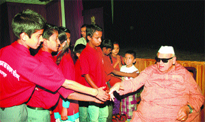 Uttarakhand Governor Aziz Qureshi meets under priviliged children at the Raj Bhavan in Dehradun on Wednesday.