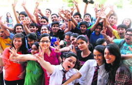 Students of Brightlands School and St Josephs Academy  celebrate after getting good grades in class X ICSE exams in Dehradun on Wednesday. 