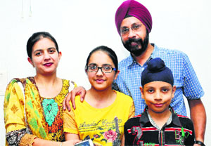 Sunpriya Kaur Bhatia (middle), along with her parents, in Jalandhar on Wednesday. 