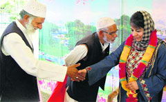 PDP president Mehbooba Mufti meets party supporters at her residence in Srinagar on Wednesday. PTI