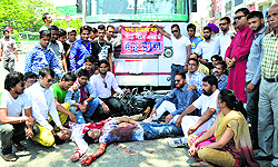 Punjab Shiv Sena activists protest against reckless driving by private bus operators in Ludhiana