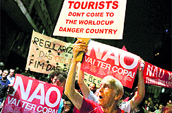 Demonstrators shout slogans during a protest against the 2014 World Cup in Sao Paulo last week