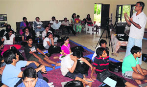 Prof Vinay Kumar and Rajat Mishra explain a concept to the students at the Gurukul camp in Manav Bharti School, Aghelia, in Dehradun on Thursday.