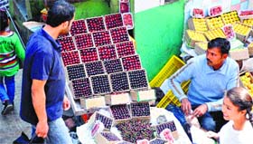A vendor sells cherry in Shimla on Thursday.