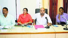 Zila Parishad Chairman Amit Bharmouri presides over a review meeting in Chamba on Thursday.