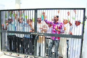 AAP activists hold demonstration outside mini secretariat at Sirsa on Thursday. 