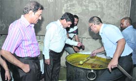 Civil Surgeon Dr RL Bassan inspects mid-day meal at Government Senior Secondary School at Khurla Kingra in Jalandhar on Thursday.