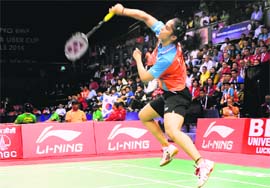 Saina Nehwal plays a shot against Lindaweni Fanetri of Indonesia during the Uber Cup in New Delhi on Thurday.