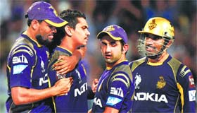 KKRs captain Gautam Gambhir celebrates a wicket with his teammates at Eden Gardens in Kolkata on Thursday.