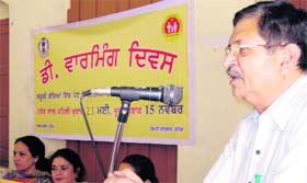 Civil Surgeon Dr Vinod Garg speaks on De-worming Day in Bathinda on Friday.