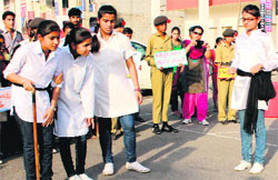 Students of Government School, Sector 15, enact a play on traffic awareness at Sector 16 in Panchkula on Friday. Tribune photo: Nitin Mittal