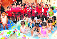 Students enjoy during a splash pool party at Tribune Model School, Sector 29, Chandigarh, on Friday. Tribune photo