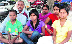 Lorik Das and his family stage a dharna outside the Zirakpur police station on Friday. Tribune photo: Nitin Mittal