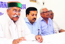 Jot Singh Ghansola tells mediapersons about the Gold Cup Cricket Tournament in Dehradun on Friday. 