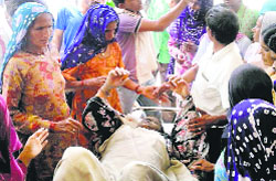 Family members of the patient outside the Civil Hospital in Hisar on Friday.