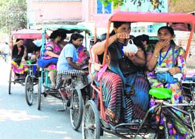 Tourists enjoy rickshaw rides in Amritsar on Saturday