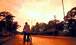 A cyclist rides his way home in Karnal on Saturday