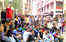 SFI activists protest on HPU campus in Shimla on Saturday
