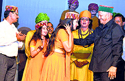 Chief Minister Virbhadra Singh honours artistes of Shriram Bharatiya Kala Kendra at the Gaiety Theatre in Shimla on Friday